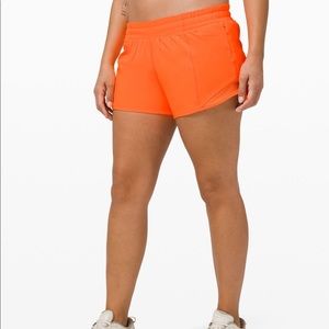 Lululemon hotty hot 4” shorts, highlight orange